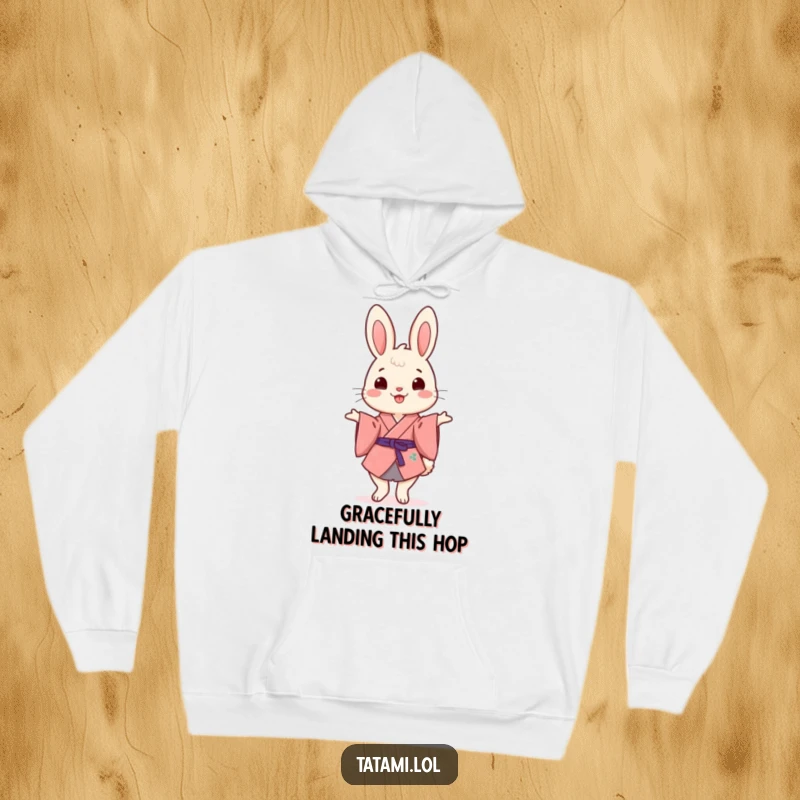 Funny Kimono Rabbit Hoodie: A cheerful rabbit wearing a kimono, humorously balancing on its hind legs, perfect for cozy laughs.